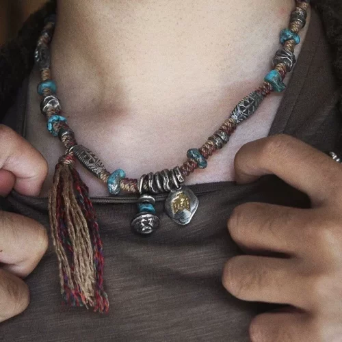 Bohemian tibetan necklace worn on neck – turquoise & silver spiritual amulet jewelry