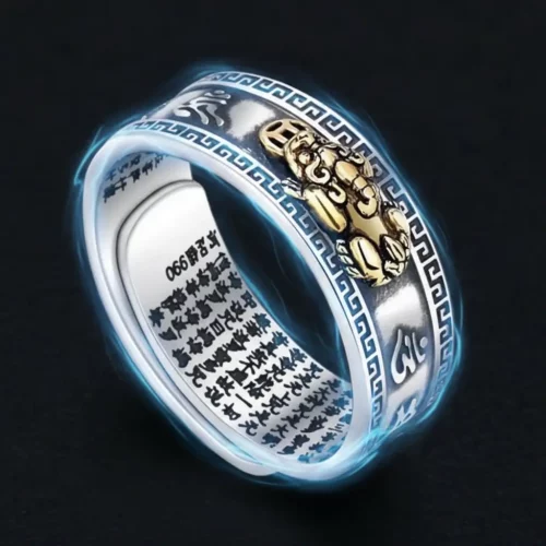Glowing silver Pixiu ring with blue spiritual energy aura effect showing metaphysical power