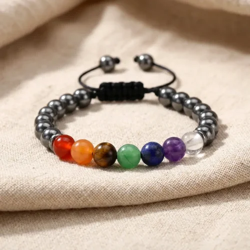 Adjustable 7 chakra crystal bracelet on natural linen fabric