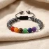 Adjustable 7 chakra crystal bracelet on natural linen fabric