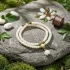 Bodhi seed prayer beads with jade lotus on natural stone with prayer wheel