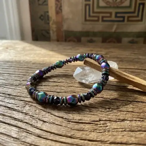 Chakra gemstone bracelet with wooden background
