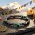 Chakra healing bracelet with mountain mandala setting