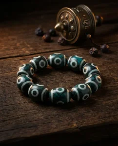 Green turquoise nine eye dzi bracelet with antique prayer wheel