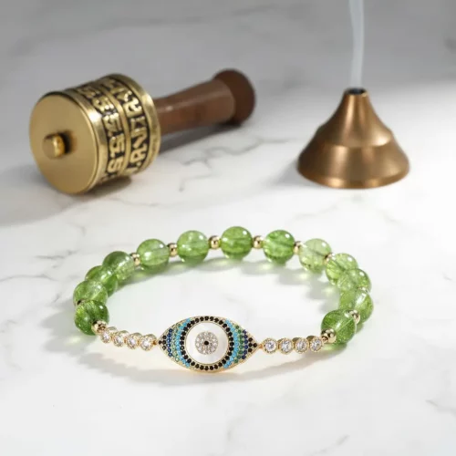 Natural peridot bracelet with tibetan prayer wheel styling