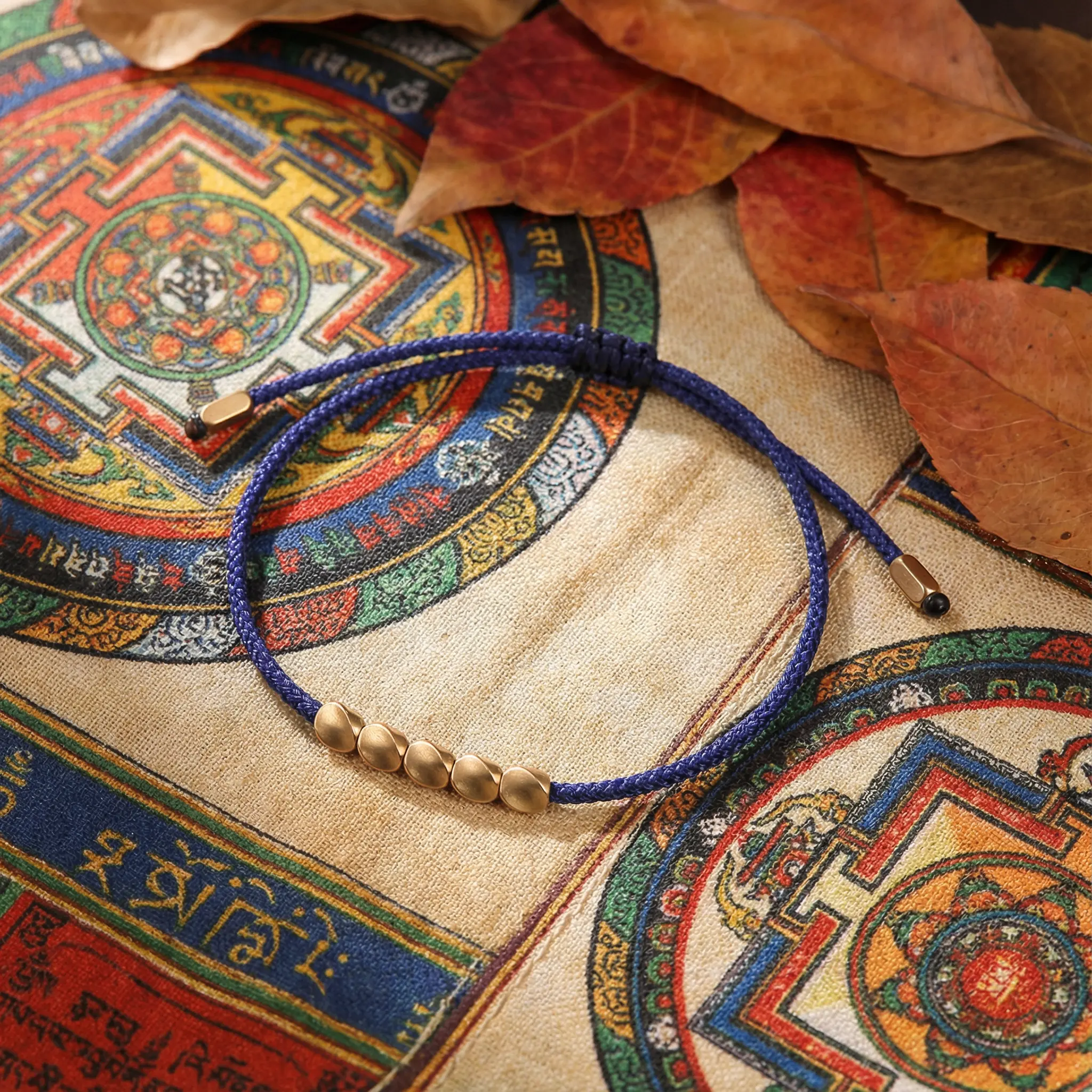 Tibetan Buddhist Copper Bead Bracelet on Traditional Thangka - Navy Blue String Tibetan buddhist copper bead bracelet on traditional thangka navy blue string