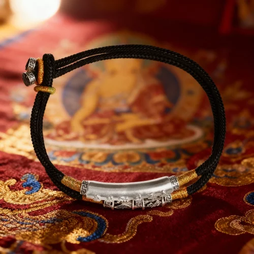 Tibetan buddhist mantra bracelet on traditional thangka background