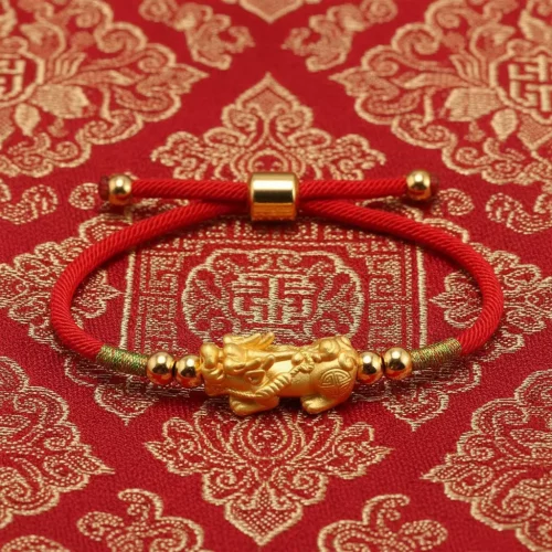 Traditional pixiu bracelet on tibetan brocade fabric background