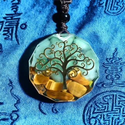 Tree of life orgone pendant on traditional tibetan blue brocade fabric