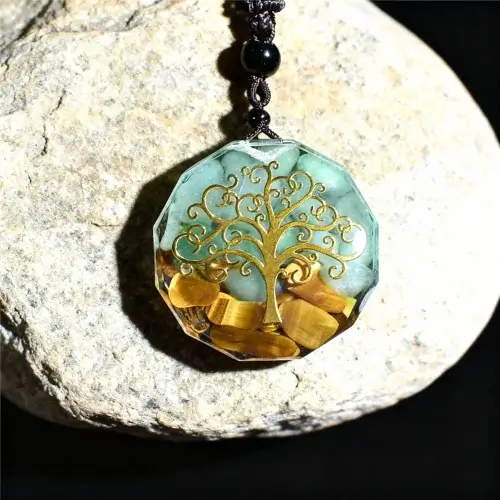 Tree of life orgone pendant with tiger eye crystals on natural stone