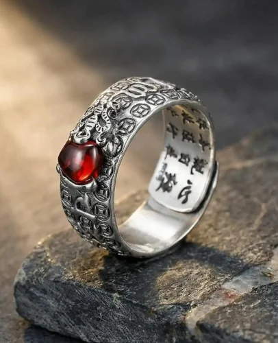 Feng Shui Pixiu Mantra Ring with Natural Red Garnet Stone on Gray Slate Feng shui pixiu mantra ring with natural red garnet stone on gray slate
