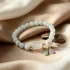 Jade flower bracelet on silk fabric background