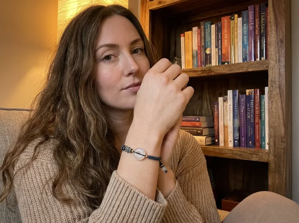woman-reading-wearing-white-agate-bracelet-bookshelf Woman reading wearing white agate bracelet bookshelf