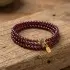 Handmade garnet bracelet artisan wooden display