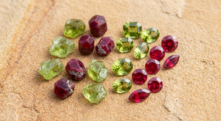 Leo Birthstone Peridot and Ruby Gemstones Peridot and ruby gemstones side by side, representing the primary birthstones for Leo zodiac sign