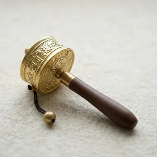 Tibetan Prayer Wheel on Wooden Surface
