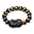 Black obsidian Pixiu wealth bracelet with gold Om Mani Padme Hum mantra engraving and tiger's eye bead, front view