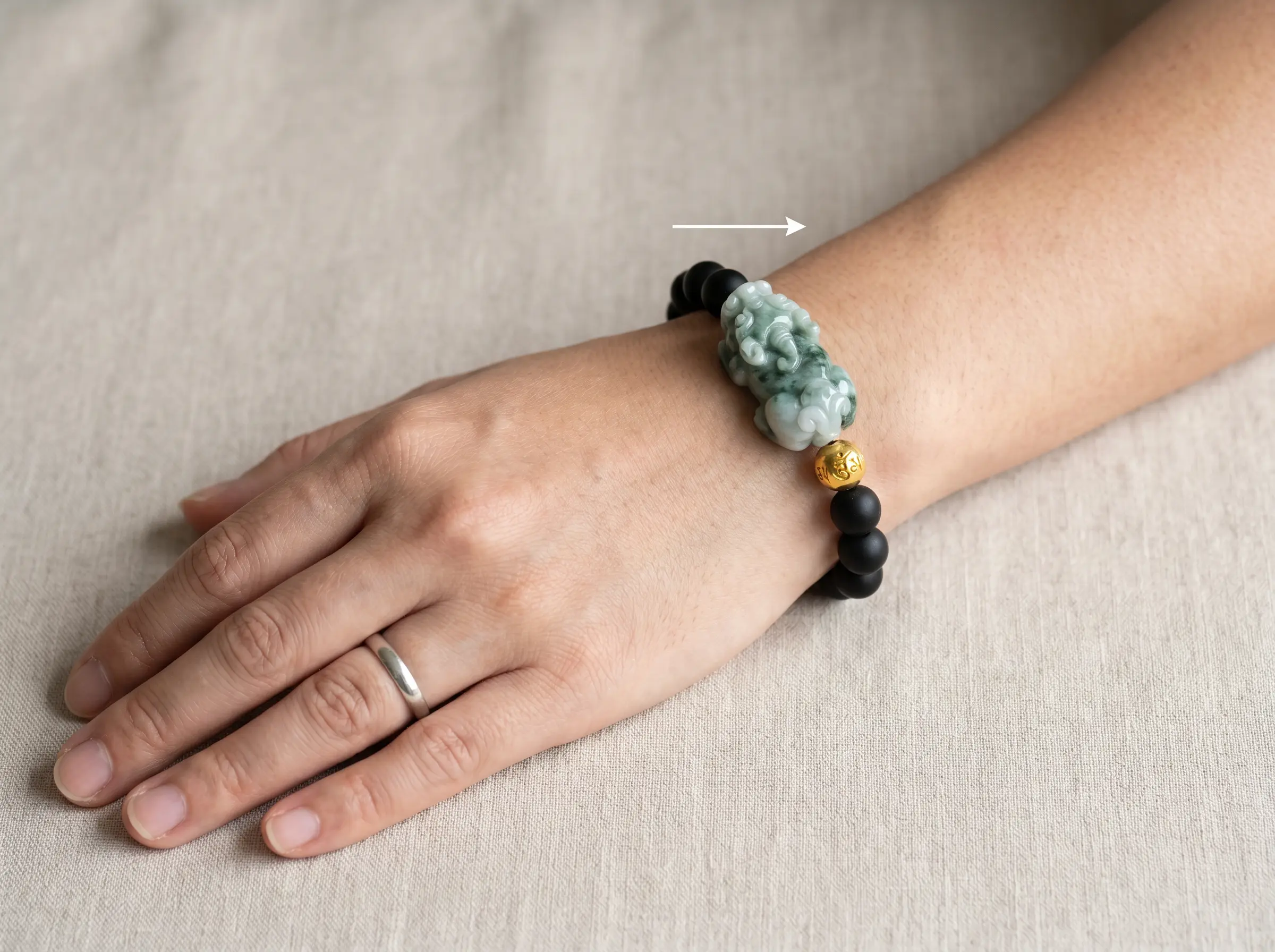 Pixiu bracelet worn on the left wrist with the Pixiu head facing outward toward the little finger