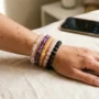 Crystal bracelets for angel numbers 111 to 999 Stacked healing crystal bracelets for angel numbers on a woman's wrist in soft natural light