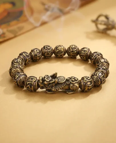 Pixiu Mantra Bracelet with Thangka and Vajra Copper Pixiu Feng Shui bracelet with a Tibetan thangka, vajra and incense smoke in the background