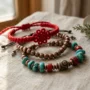 Tibetan Bracelet Meaning – Authentic Handmade Bracelets Authentic handmade Tibetan bracelets in copper, turquoise, and red string on a natural linen background