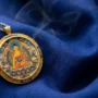 Tibetan Guardian Buddha pendant necklace on dark silk Tibetan Thangka Buddha pendant necklace representing the eight Benming Guardian Buddhas of the Chinese zodiac