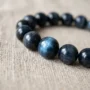 blue-tiger-eye-bracelet-natural Natural blue tiger eye bracelet showing blue-gray chatoyancy and moving light band