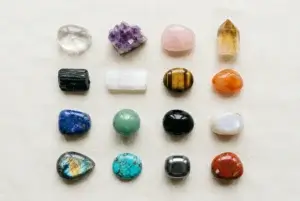 Crystal meanings chart showing 16 beginner crystals with their colors, chakras, and traditional meanings
