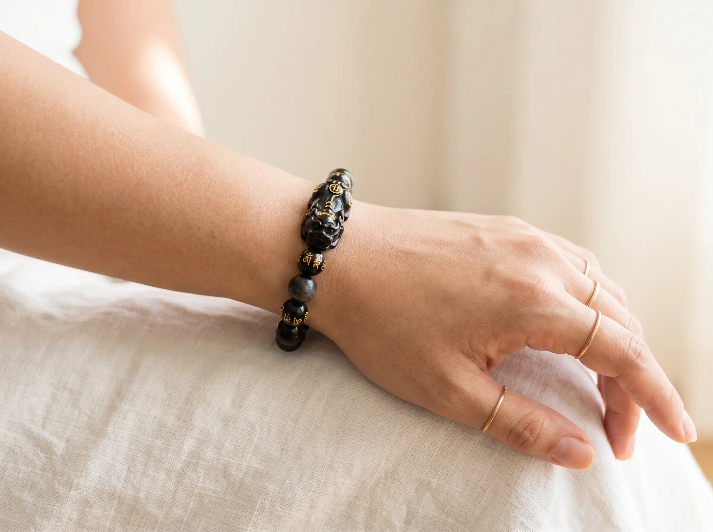 Pixiu bracelet worn on the left wrist with the Pixiu head facing outward according to feng shui tradition