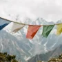 old-tibetan-prayer-flags-weathered Weathered five-color Tibetan prayer flags fading on a string, showing when to respectfully dispose of old prayer flags