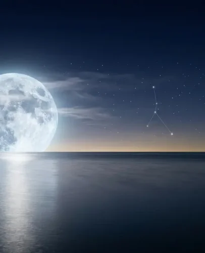 Luminous full moon reflected on calm water in a starry indigo sky, symbolizing the Cancer 2027 horoscope