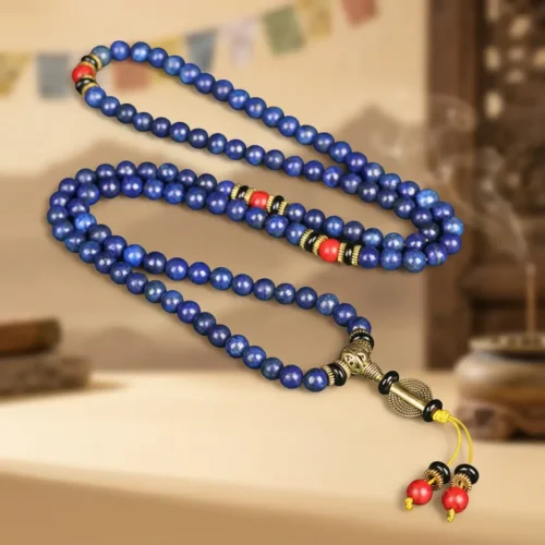Full-length 108 lapis lazuli mala necklace with gold guru bead, red turquoise markers and yellow tassel